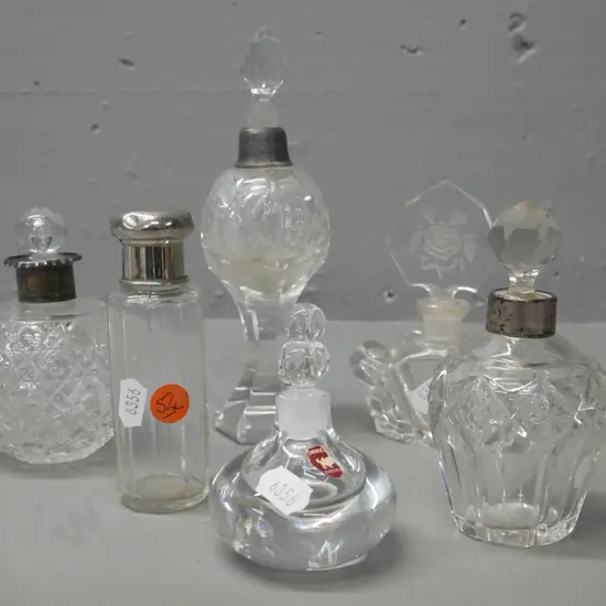 6x glass scent bottles, 2 w/ stamped hallmark silver collars, 1 w/ plated screw-on lid, 1 w/ damage to plated top,