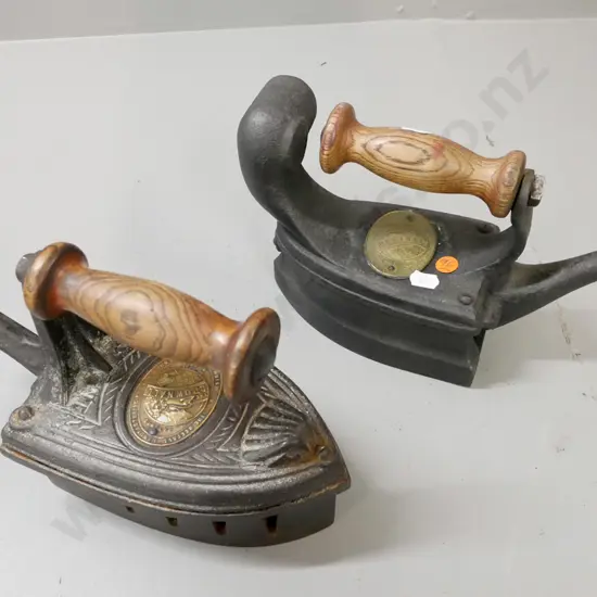 2x vintage cast iron coal irons w/ turned wooden handles. Beetall Manufacturing Co. Larger H-160 W-270