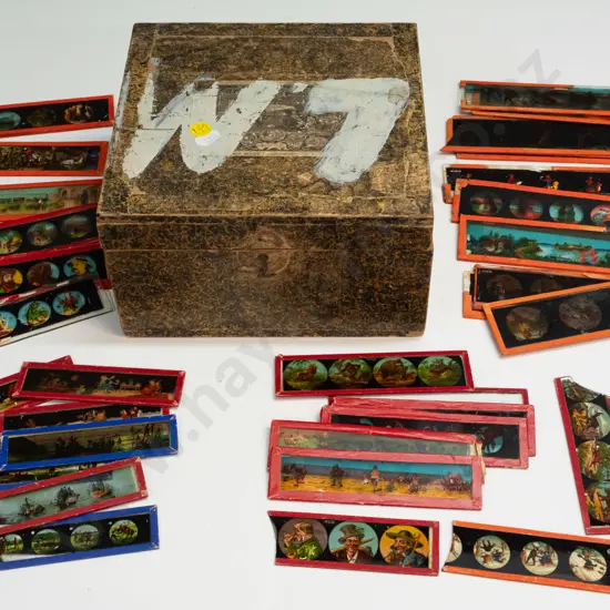33 vintage lantern slides and a box for a magic lantern, no lantern included. Slides in 4 different sizes, largest are