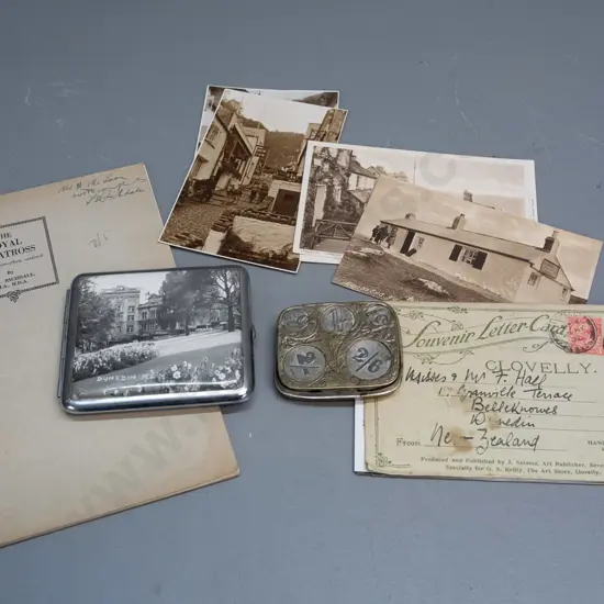 Cigarette case with Dunedin photo, Royal Albatross booklet, English spring loaded coin holder, and assorted postcards &