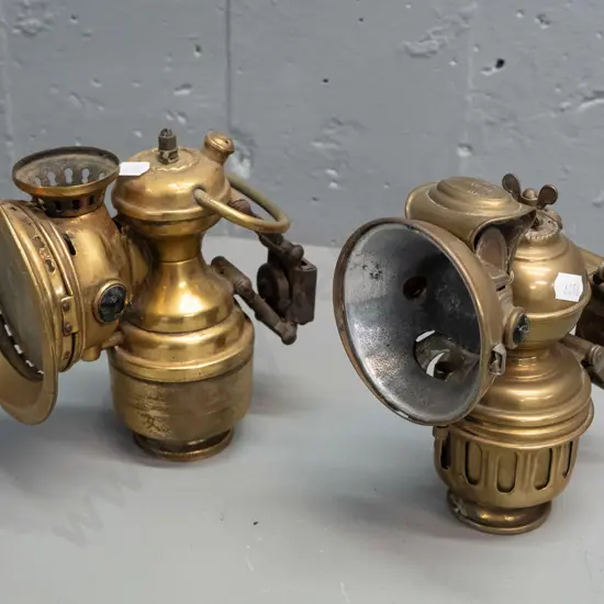2 vintage brass carbide bicycle lanterns - one marked Herm Piemann Phanomen Chemnitz, other marked British Made, has