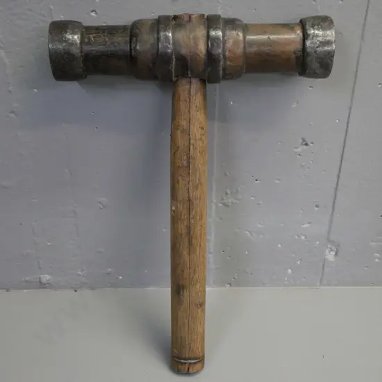 vintage hardwood double-headed mallet w/ cast metal binding. Split to handle w/ wire-bound repair. L-380 W-260