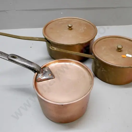3x vintage saucepans, coppered white metal. Two with brass handles, one with cast handles.