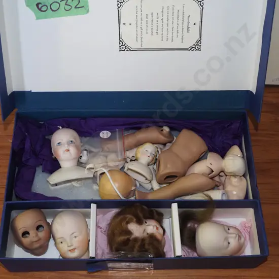 box; porcelain dolls, heads, arms etc