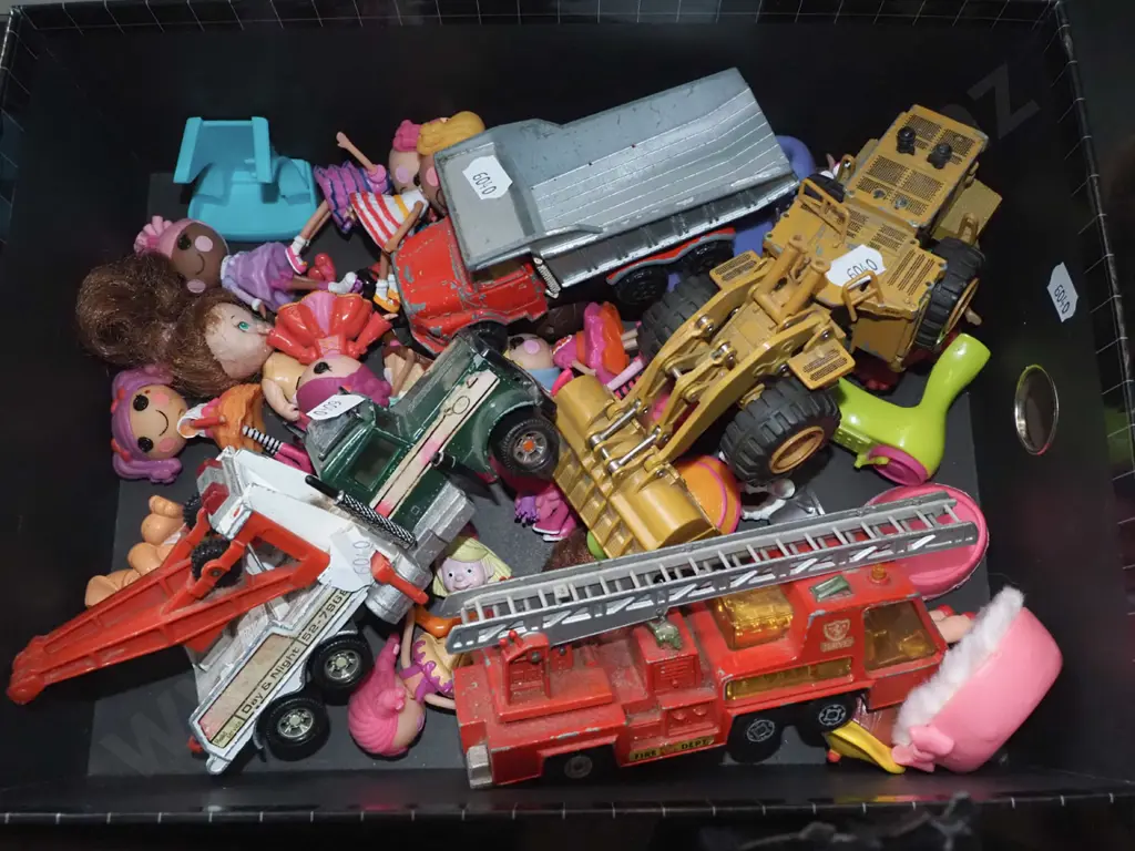 box of toy vehicles, small dolls Image 1++