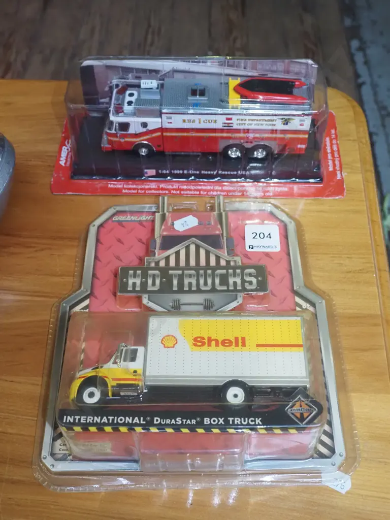 2 carded model vehicles - fire truck and Shell truck Image 1++