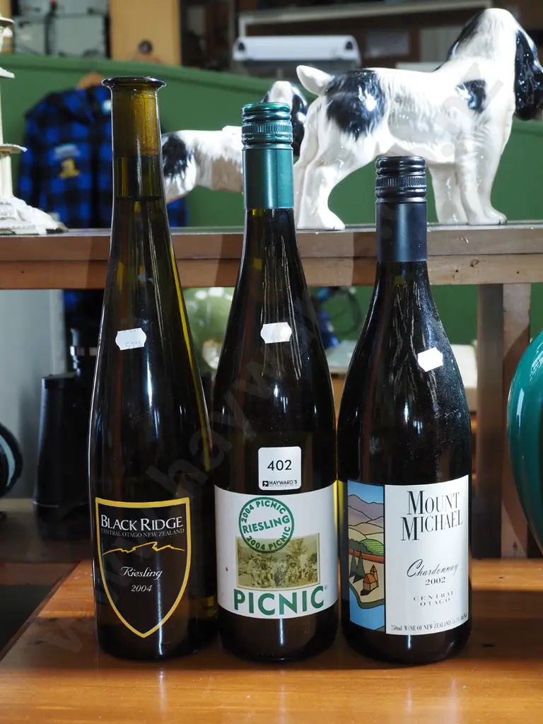 2x bottles of reisling, 1x bottle of chardonnay Image 1++