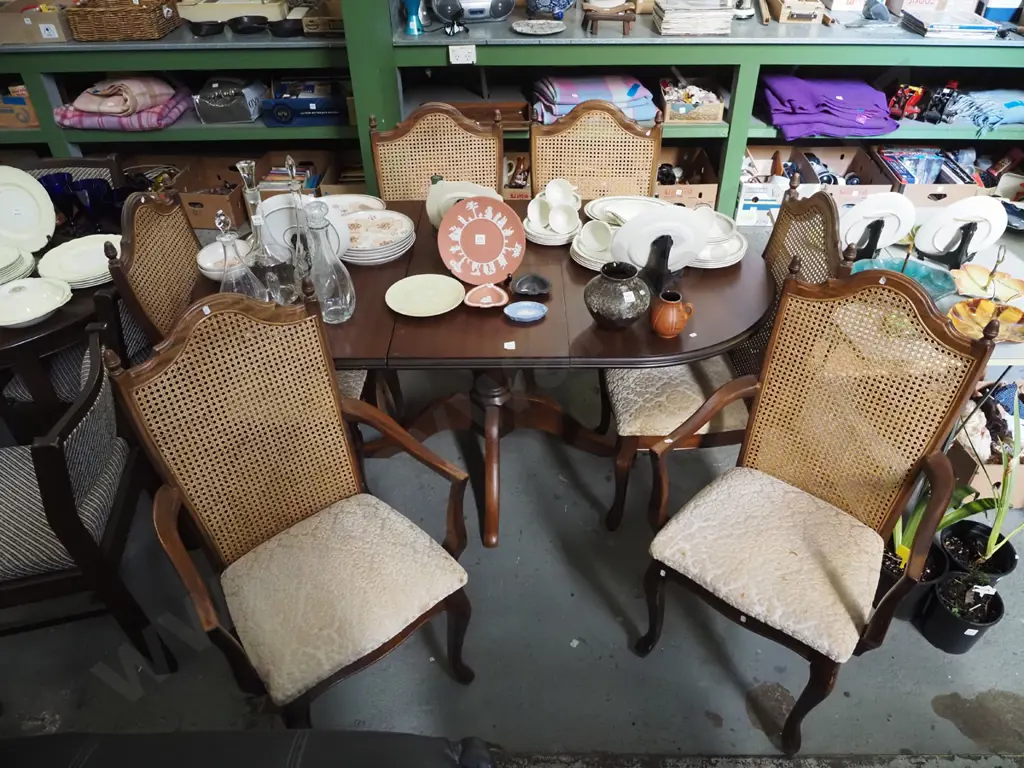pedestal mahogany veneer top extending dining table with 6 matching rattan back chairs Image 1++
