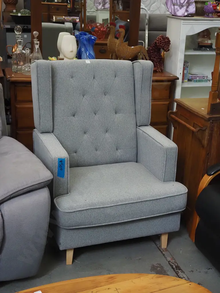 grey upholstered deep buttoned fireside chair Image 1++