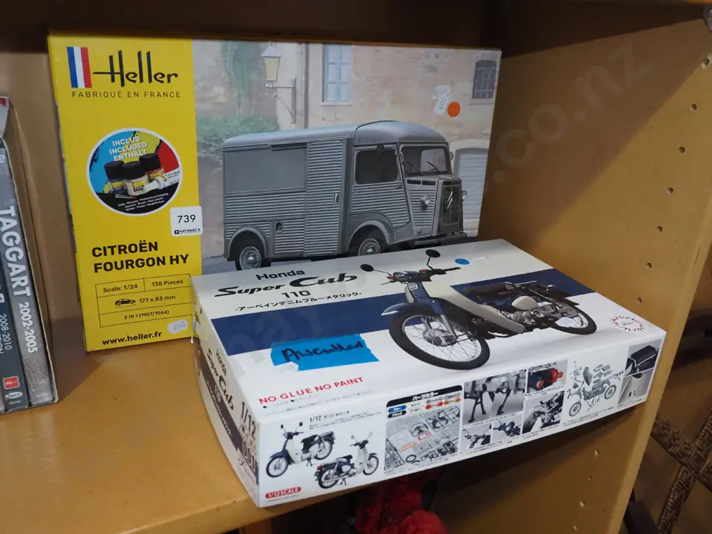 yet to be assembled Citroen van, assembled model of a Honda Supercub motorcycle Image 1++