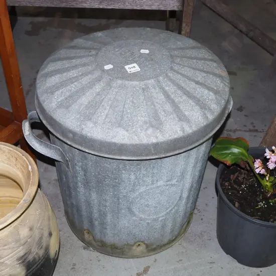 galvanised lidded ash can