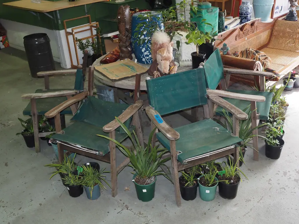 circular hardwood outdoor dining table with 4 canvas chairs -canvas stitching is starting to go Image 1++