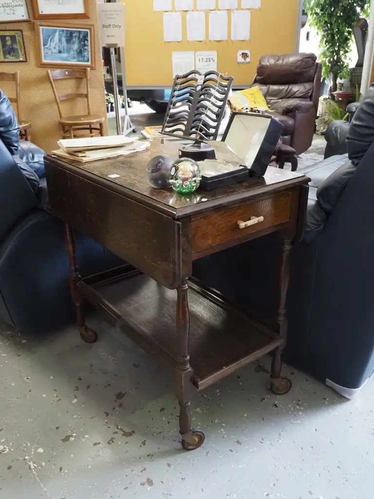 oak drop side tea trolley on casters - varnish needs attention Image 1++