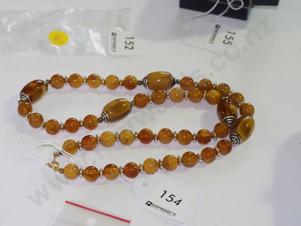 strand of pressed amber 60cm 9.6/9.8 round beads with 5 x16mm tube beads Image 1++