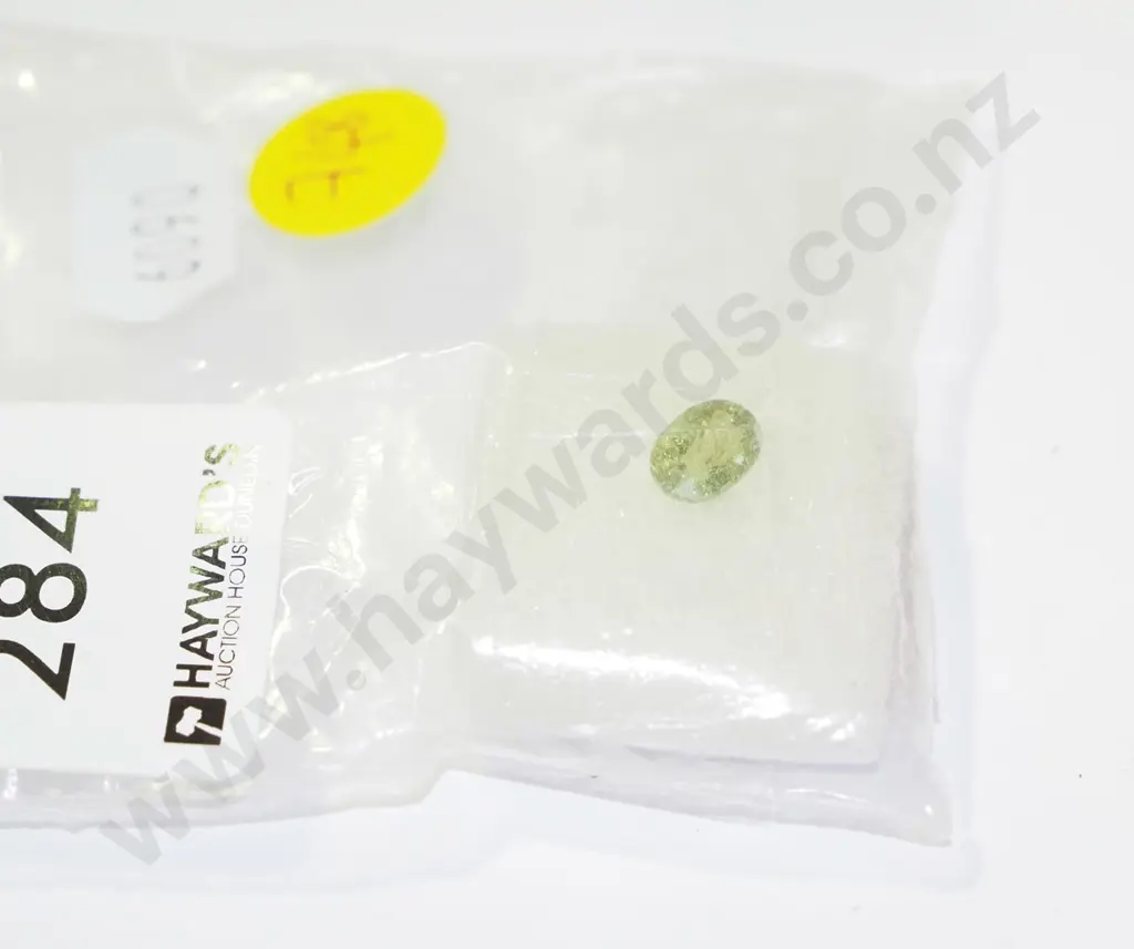 5.6 x 7.66 oval light green tourmaline stone Image 1++