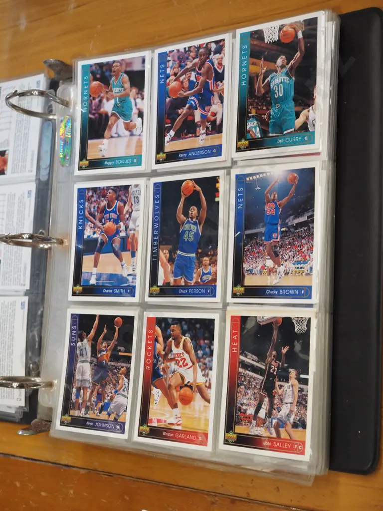 basketball trading cards in album Image 1++