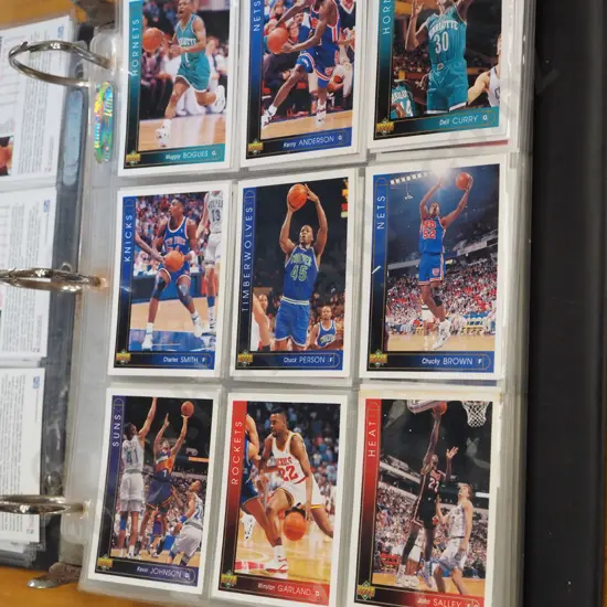 basketball trading cards in album