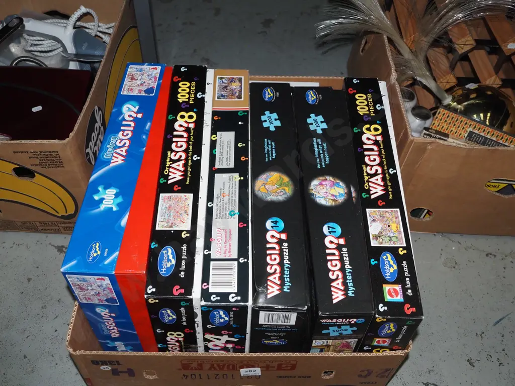 box of wasgij puzzles Image 1++