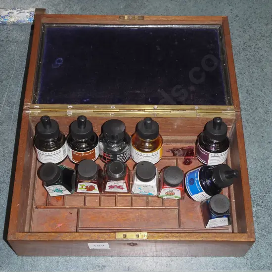 oak lidded box with inlay shield on top, velvet interior and bottles of ink - spilled ink residue inside