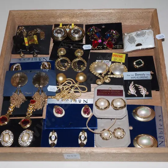 various clip on earrings and tray