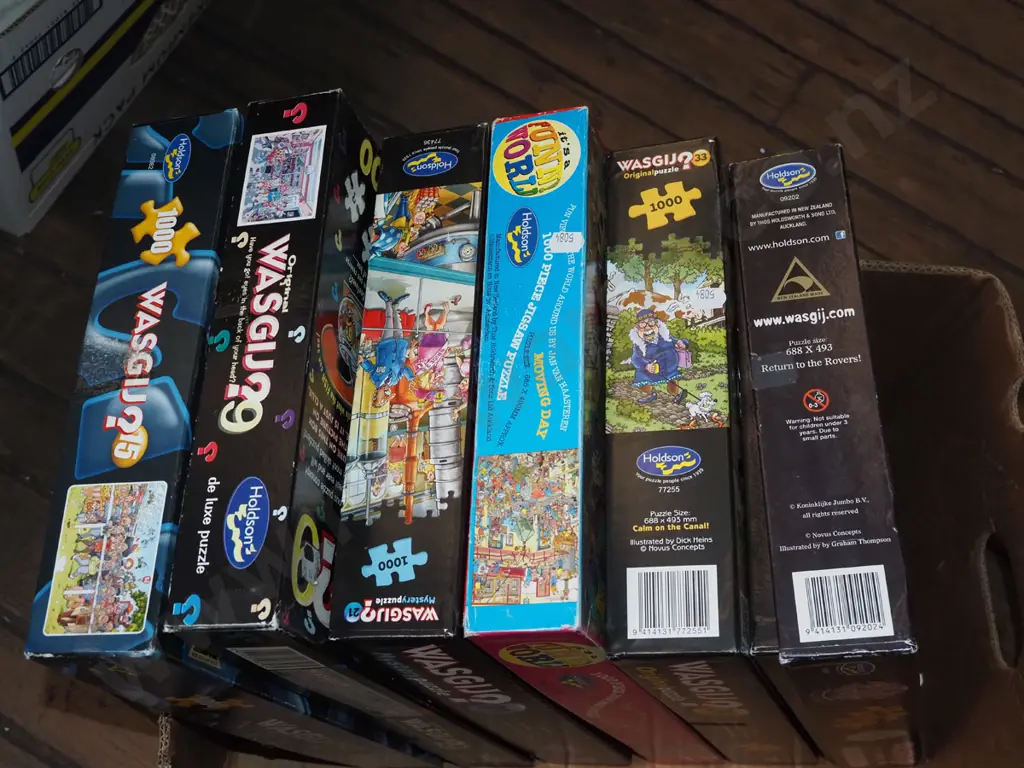 box of wasgij puzzles Image 1++