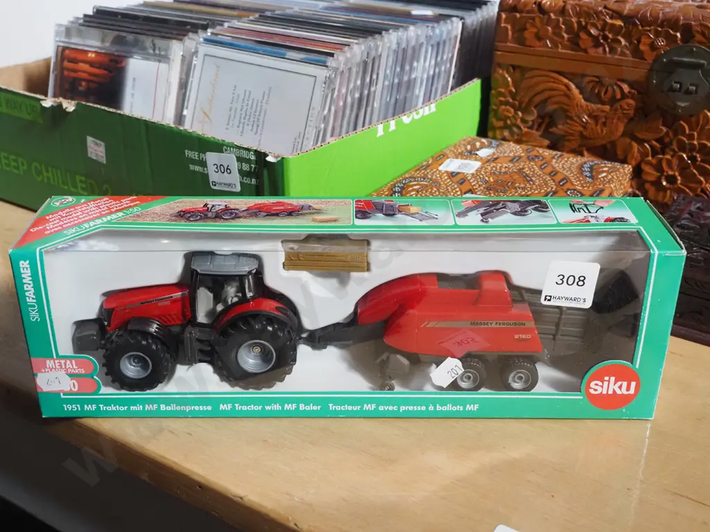 cased as new tractor and hay bailer Image 1++