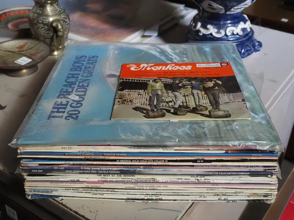stack of assorted LPs and a Monkees 7" Image 1++
