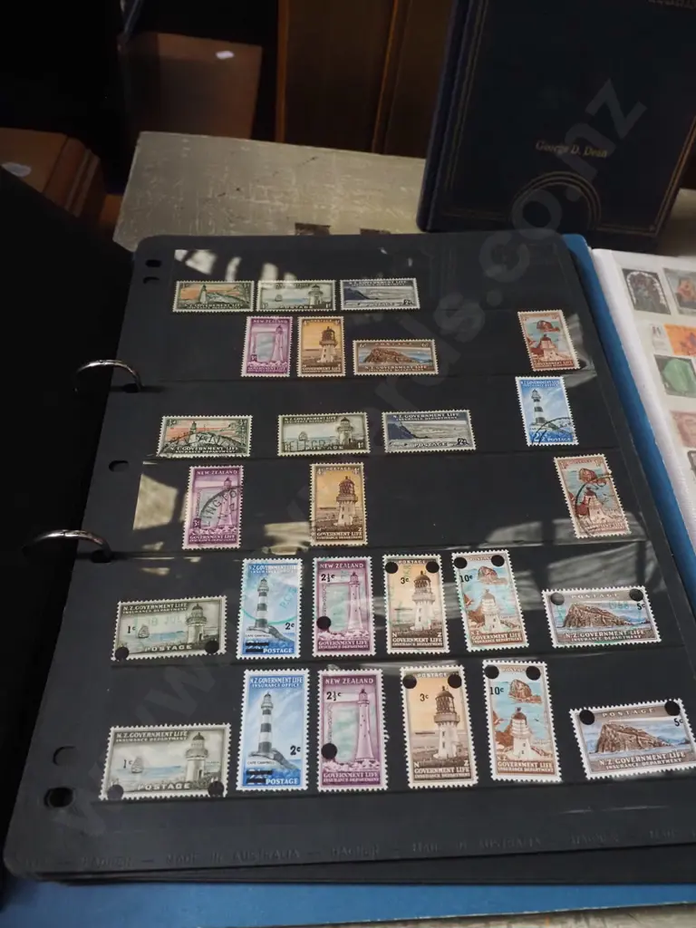 2x stamp albums, book on tokens and medals Image 1++