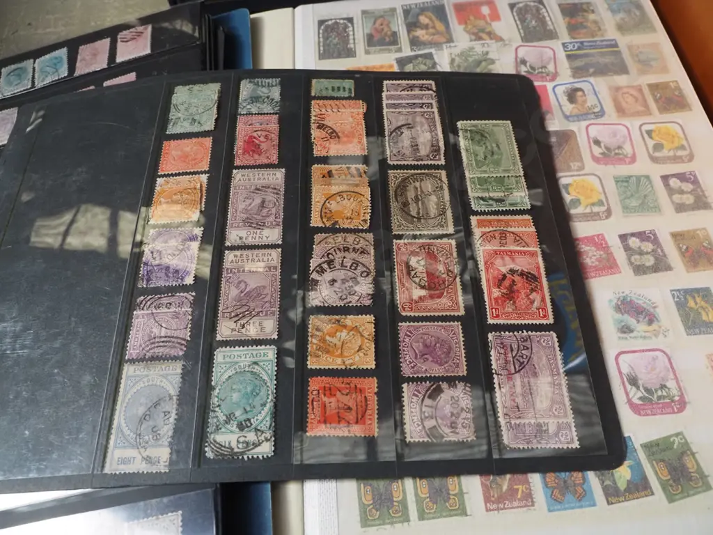 2x stamp albums, book on tokens and medals Image 1++