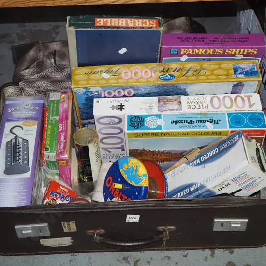 vintage suitcase; puzzles, board games, electric clippers etc