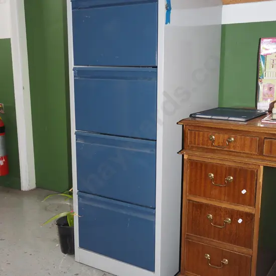 blue and grey 4 drawer filing cabinet - key in office