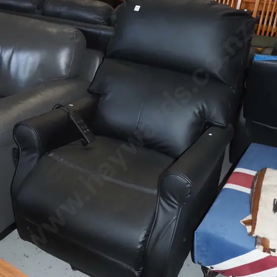 black vinyl upholstered electric chair