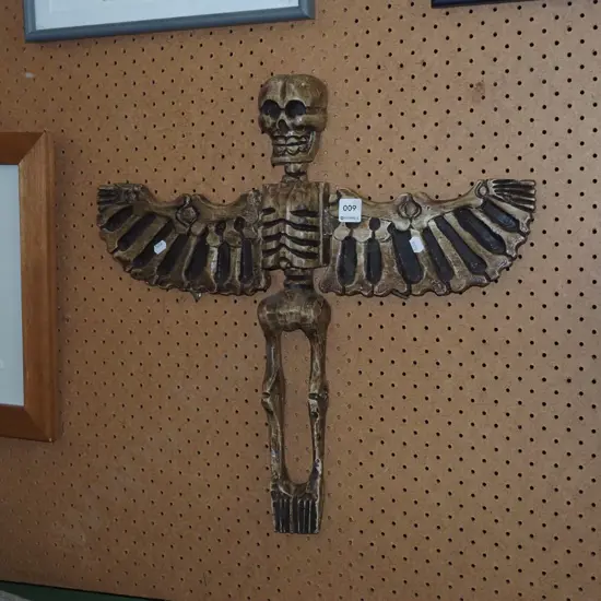 carved wooden skeleton angel