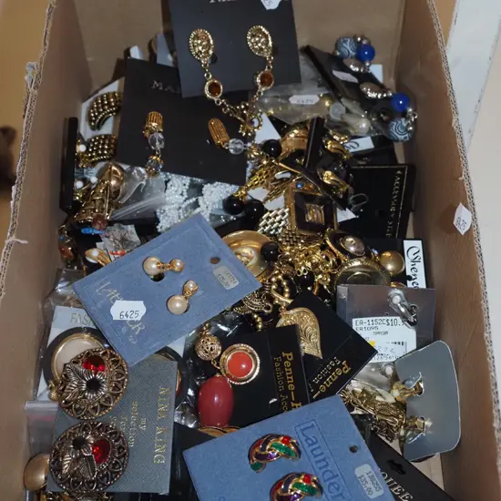 box of costume clip on earrings