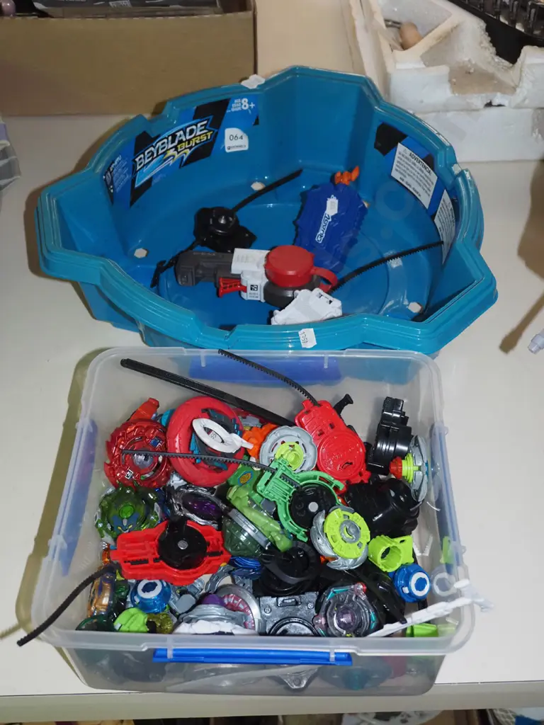 plastic container of Bey Blades and a tournament container Image 1++
