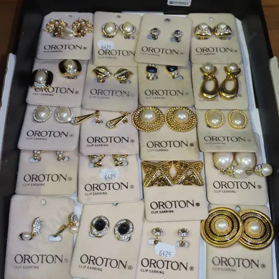 box of Oroton clip on earrings