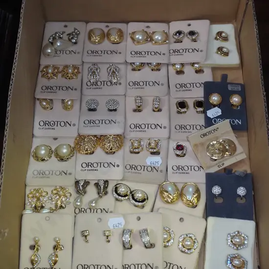 box of Oroton clip on earrings