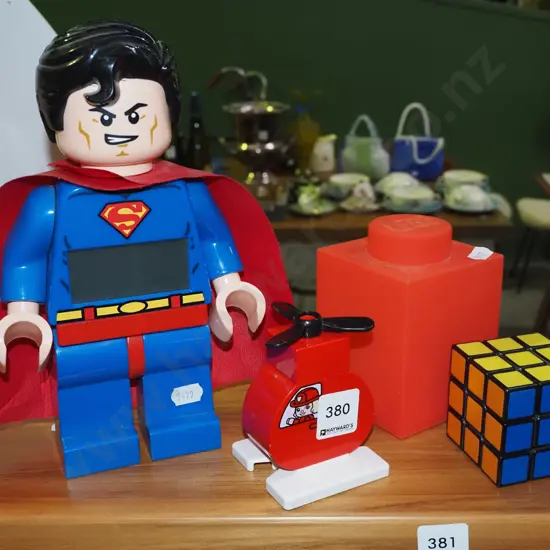 Superman toy, Duplo plane, rubiks cube etc