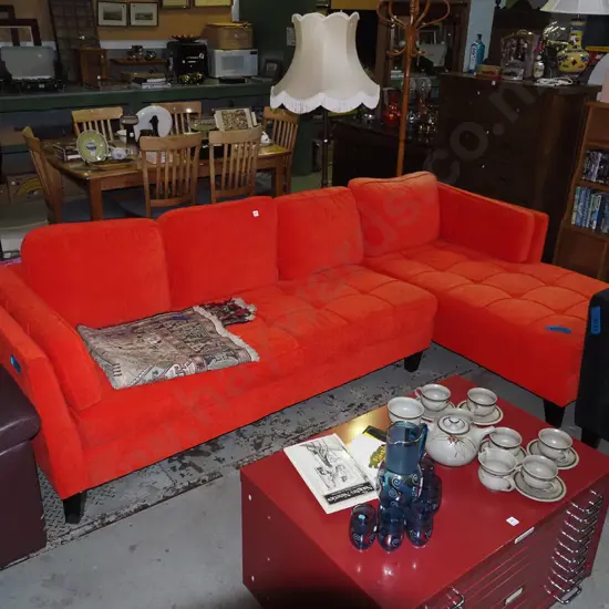 deep buttoned upholstered red corner lounge suite with right hand L return