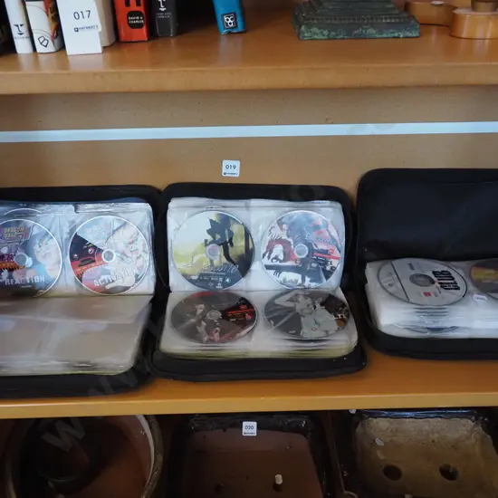 3x pouches of anime movies, x box games etc