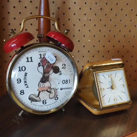 Mickey Mouse clock and a travel alarm clock