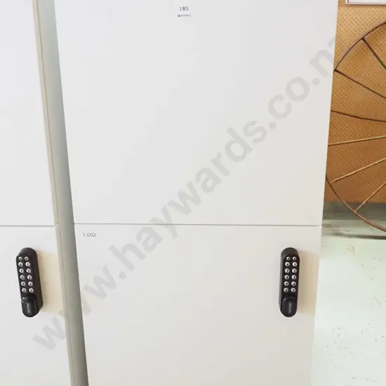 bank of 2 lockers with push button locks - code in office