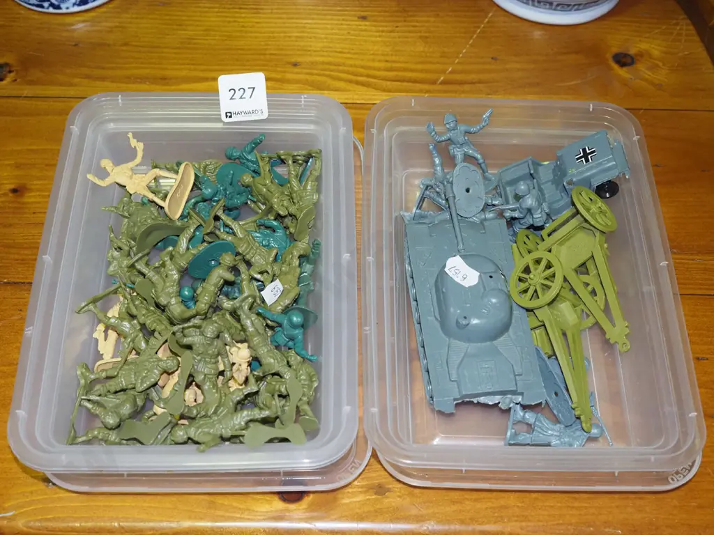 2x plastic containers of military figurines and models Image 1++