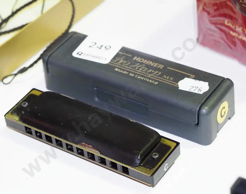 cased Hohner harmonica Image 1++