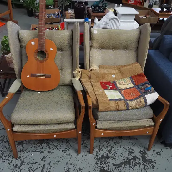 pair of mahogany mid century wingback deep buttoned armchairs