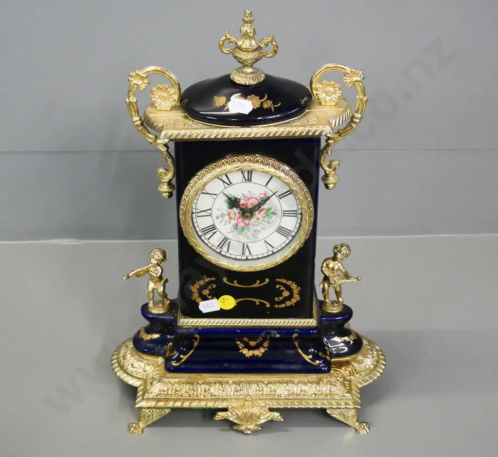 reproduction French style porcelain cased clock with painted dial and brass decoration H-330 W-230 Image 1++