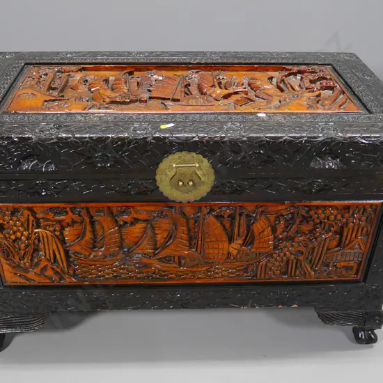 large Chinese carved camphorwood chest with ball-and-claw feet, brass catch and plate H-620 W-1000 D-530
