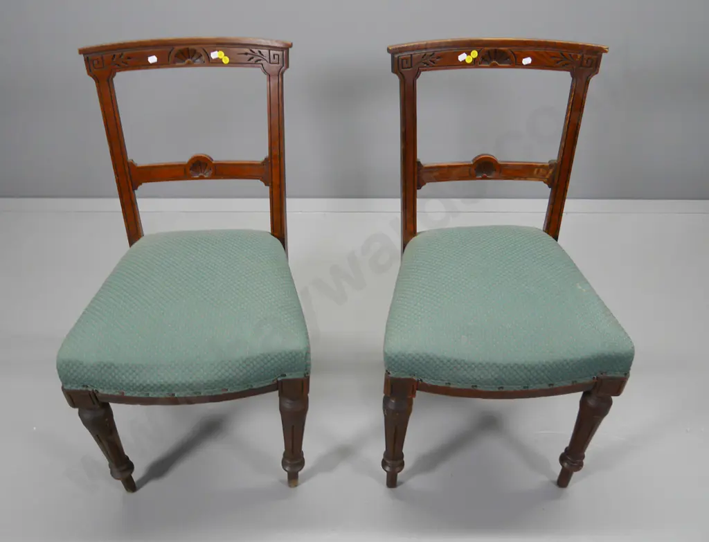 pair of oak carved-back dining chairs with green damask upholstered seats, some looseness in joints Image 1++