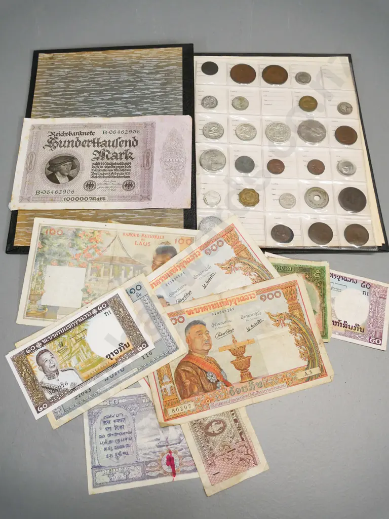 folder of international coins - Ceylon, USA, Australia, bank notes from Laos & German 100,000 mark banknote Image 1++