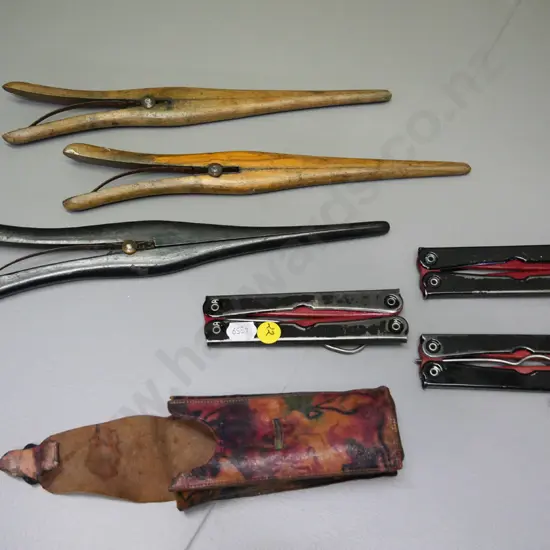 3 vintage wooden glove stretchers and a set of 3 folding travel coat hangers in soft leather case